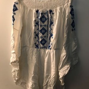 White romper with blue accents